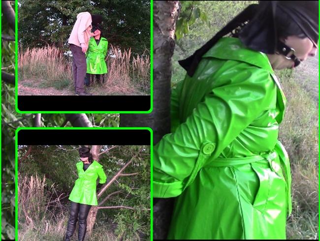 Handcuffed in green shiny raincoat