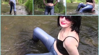 Im Fluss mit nassen und schmutzigen Jeans