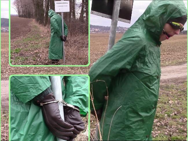 In the raincoat and wellies handcuffed to iron bar