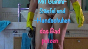 Mit Gummi-Stiefel und Handschuhen das Bad putzen