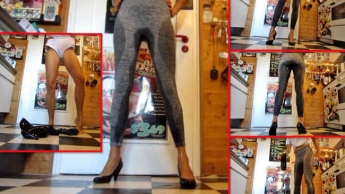 Piss in grauer Leggings und Pumps in der Küche