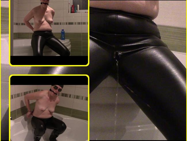 Pissing in leaky leather jeans