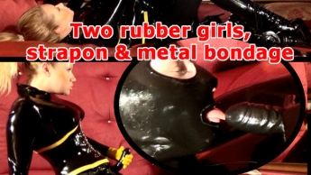 Two rubber girls, strapon & metal bondage