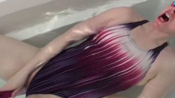 Violett swimsuit meets pink vibrator underwater in bathtube orgasm